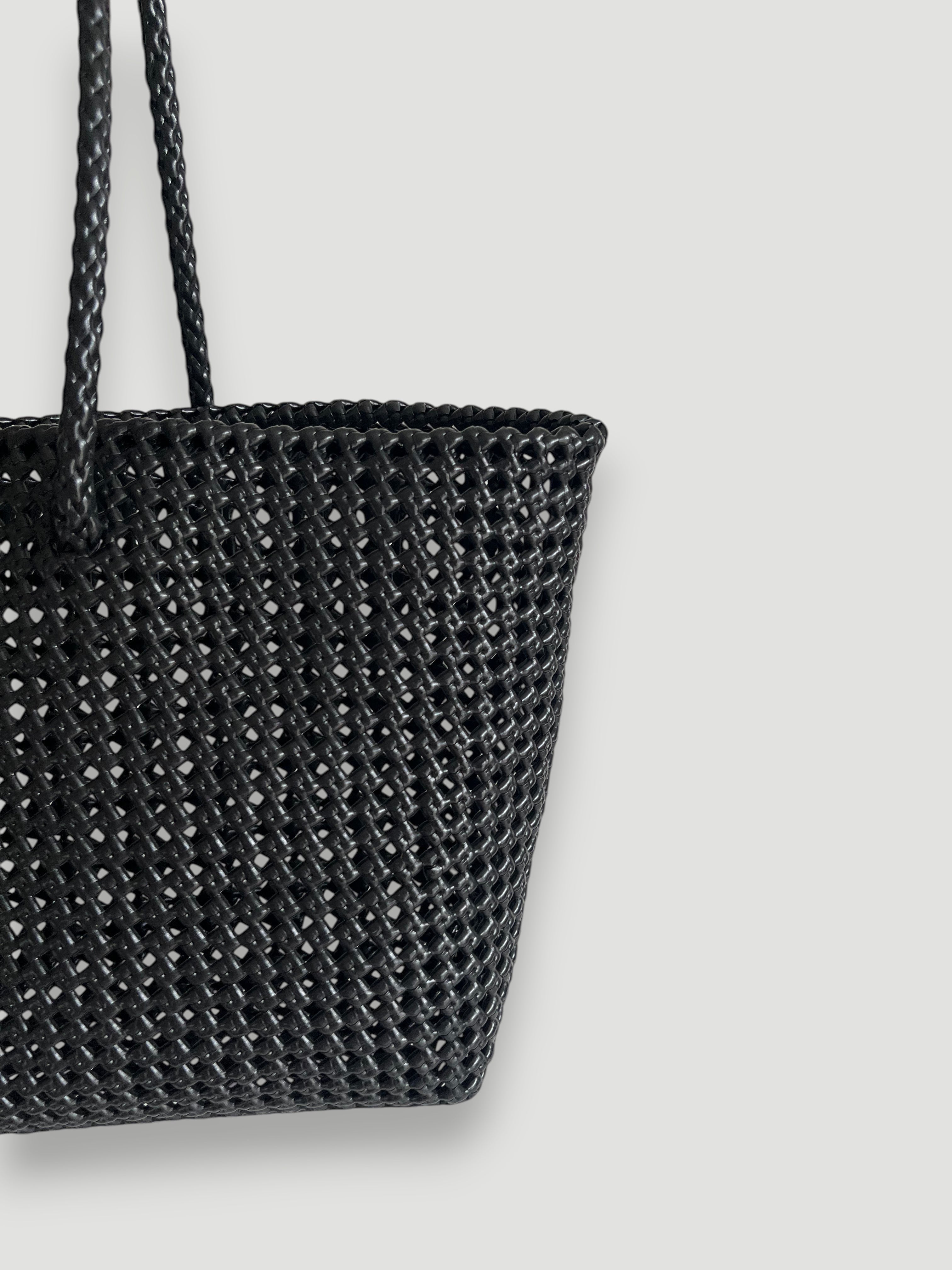 MOKA large black woven tote bag made from recycled plastic and silk with braided handles. Handmade and durable.